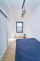 Posteľ alebo postele v izbe v ubytovaní Apartamenty Muzyczna 14
