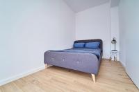 Posteľ alebo postele v izbe v ubytovaní Apartamenty Muzyczna 14