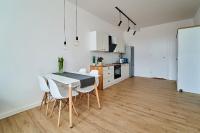 Kuchyňa alebo kuchynka v ubytovaní Apartamenty Muzyczna 14