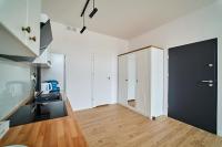 Kuchyňa alebo kuchynka v ubytovaní Apartamenty Muzyczna 14