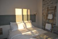 Posteľ alebo postele v izbe v ubytovaní Petras Gi - Stone Houses