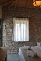 Posteľ alebo postele v izbe v ubytovaní Petras Gi - Stone Houses