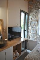 Televízia a/alebo spoločenská miestnosť v ubytovaní Petras Gi - Stone Houses
