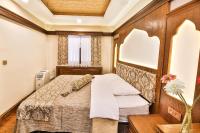 Postel nebo postele na pokoji v ubytování Kumluk Konak Hotel