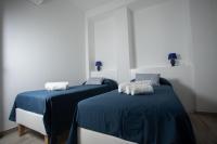 Posteľ alebo postele v izbe v ubytovaní Villa Aurora Mondello Addaura