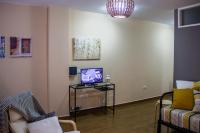 TV a/nebo společenská místnost v ubytování Acogedor apartamento con vista al mar