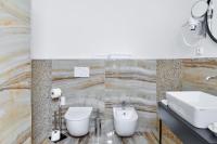 a bathroom with a sink and a toilet at Hotel Garden Court in Prague