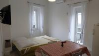 Postel nebo postele na pokoji v ubytování Josipa