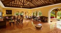 a large living room with chairs and tables at Taj Holiday Village Resort & Spa, Goa in Candolim