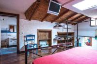 A bed or beds in a room at Casa Gisira