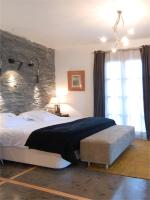 A bed or beds in a room at Hotel Casa del Abad