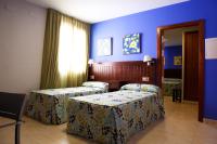Posteľ alebo postele v izbe v ubytovaní Hotel Rocio