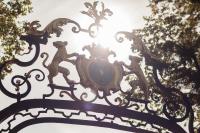 a statue of monkeys on top of a gate at Château de Pierreclos in Pierreclos