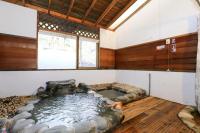 a room with a large pool of water in a house at New Life Hot Spring Resort in Yuli