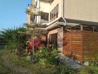 a house with a wooden fence in front of it at Celine&#39;s B&amp;B in Fenglin