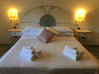 Posteľ alebo postele v izbe v ubytovaní Hotel Sorgente