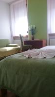 Posteľ alebo postele v izbe v ubytovaní Guest House Villa Herbarium