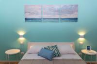 Mondello Beach - Rooms By The Seaにあるベッド