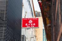 a sign for a love strain hotel on the side of a building at Longshan Inn in Taipei