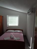 Posteľ alebo postele v izbe v ubytovaní Apartments Radoš