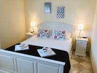 A bed or beds in a room at Villa Arzilla Sardegna