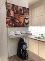 Kuchyň nebo kuchyňský kout v ubytování Nice Wellness Apartman