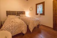 A bed or beds in a room at Casa delle rose