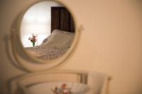 A bed or beds in a room at Casa delle rose