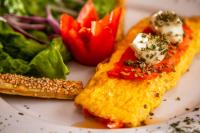 a plate of food with a plate of food with vegetables at HOTEL EL PAN NUESTRO in Tepoztlán