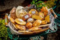a basket full of bread and pastries on a table at HOTEL EL PAN NUESTRO in Tepoztlán