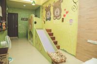 a childrens room with a slide and a staircase at Zhong Shan 330 in Hualien City