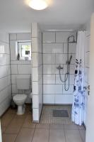 a bathroom with a shower and a toilet at Kutscherhof Broock in Broock