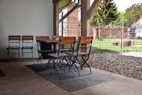 a table and chairs sitting in a patio at Kutscherhof Broock in Broock