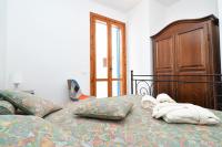 A bed or beds in a room at Casa vacanze a pochi passi dal mare - AZZURRO DEL MARE -