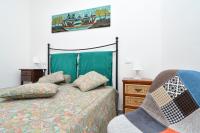 A bed or beds in a room at Casa vacanze a pochi passi dal mare - AZZURRO DEL MARE -