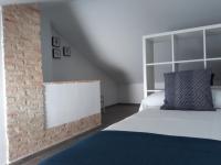 Posteľ alebo postele v izbe v ubytovaní Puerta Alameda Suites Mirador Centro Historico