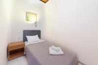 Posteľ alebo postele v izbe v ubytovaní Olympic Suites