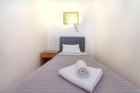 Posteľ alebo postele v izbe v ubytovaní Olympic Suites
