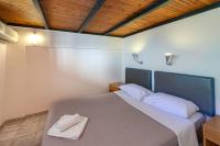 Posteľ alebo postele v izbe v ubytovaní Olympic Suites