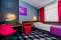 Łóżko lub łóżka w pokoju w obiekcie Hotel Wyspiański