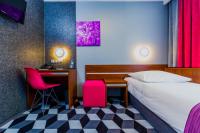 Łóżko lub łóżka w pokoju w obiekcie Hotel Wyspiański
