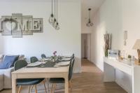 a dining room with a table and chairs at Nice Apartment Garden - 5 min DISNEYLAND Paris - Val d&#39;Europe Center in Chessy