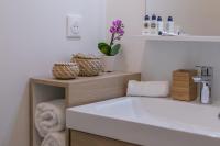 a bathroom with a white tub and a sink at Nice Apartment Garden - 5 min DISNEYLAND Paris - Val d&#39;Europe Center in Chessy