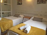 A bed or beds in a room at Viviendas Los Olivos - Formentera Break