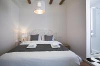 Postel nebo postele na pokoji v ubytování Tendency Apartments - Sagrada Familia