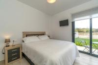 Posteľ alebo postele v izbe v ubytovaní Luxury Pinada Beach