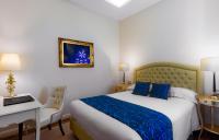 A bed or beds in a room at Grand Hotel Salsomaggiore