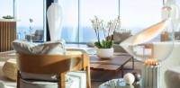 a living room with a couch and a table at Hotel Bellevue Dubrovnik in Dubrovnik