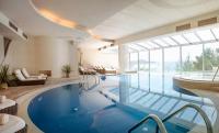a large swimming pool with a tub in a room at Hotel Bellevue Dubrovnik in Dubrovnik