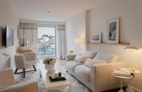 a living room with a couch and a table at Hotel Bellevue Dubrovnik in Dubrovnik